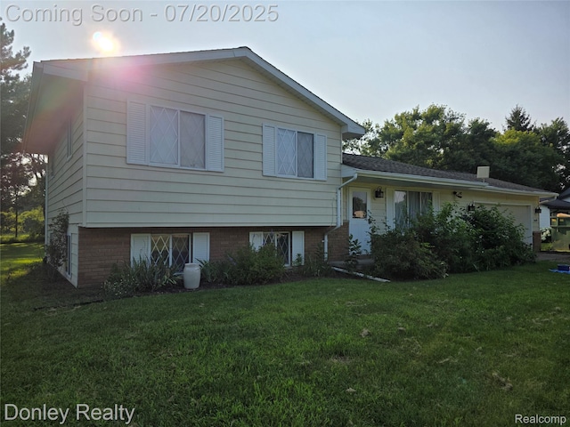 6059 Windward St, North Branch, MI 48461 - split level home with a front yard and brick siding