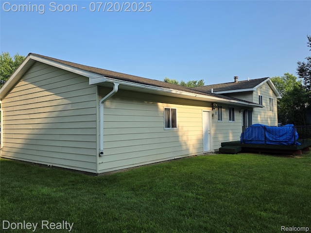6059 Windward St, North Branch, MI 48461 - view of home's exterior with a lawn and roof with shingles
