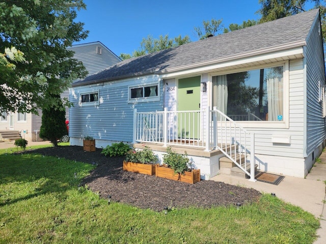 2464 Greenfield Rd, Berkley, MI 48072 - view of front of property featuring a front lawn and roof with shingles
