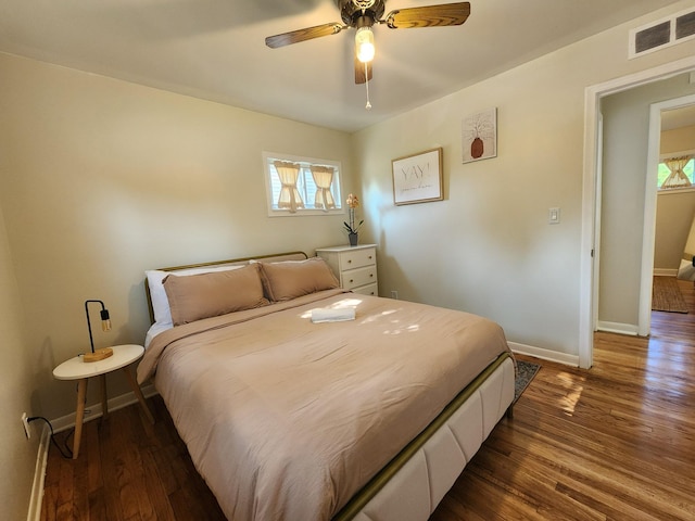 2464 Greenfield Rd, Berkley, MI 48072 - bedroom with multiple windows, wood finished floors, and a ceiling fan