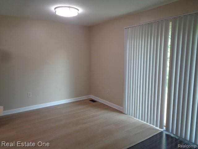 26537 Summerdale Dr, Southfield, MI 48033 - spare room featuring wood finished floors and baseboards