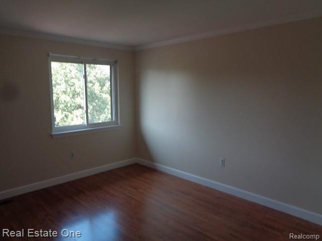 26537 Summerdale Dr, Southfield, MI 48033 - empty room featuring wood finished floors and ornamental molding