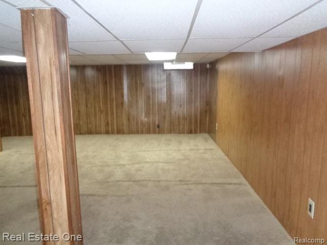 26537 Summerdale Dr, Southfield, MI 48033 - finished below grade area with a drop ceiling, wooden walls, and carpet flooring