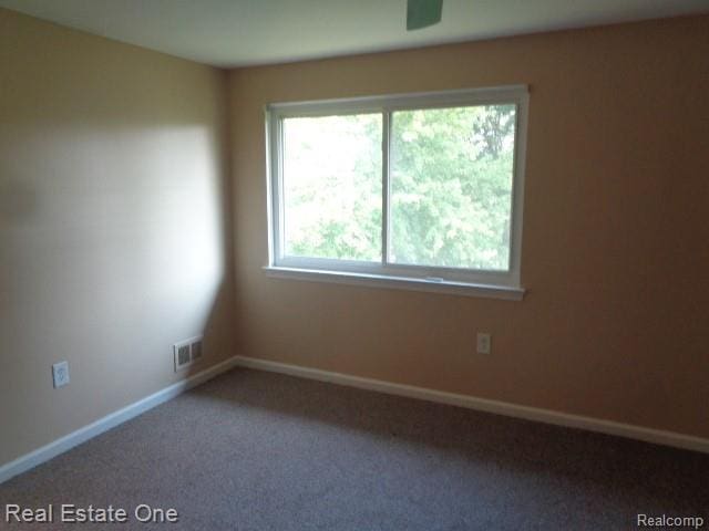 26537 Summerdale Dr, Southfield, MI 48033 - spare room featuring carpet flooring and baseboards