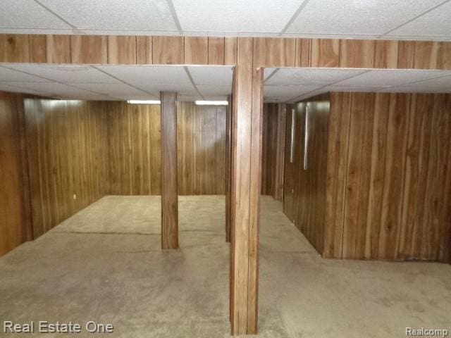 26537 Summerdale Dr, Southfield, MI 48033 - finished below grade area featuring a paneled ceiling, carpet floors, and wood walls