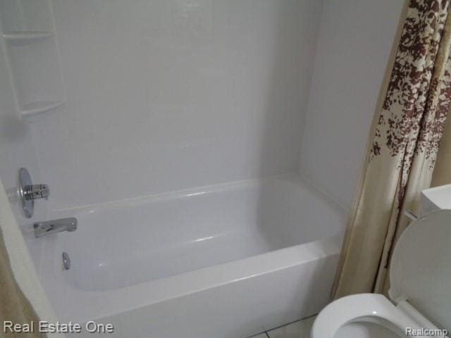 26537 Summerdale Dr, Southfield, MI 48033 - bathroom with washtub / shower combination and tile patterned floors