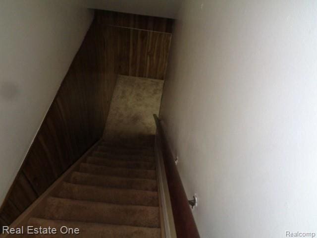 26537 Summerdale Dr, Southfield, MI 48033 - stairs with wood walls