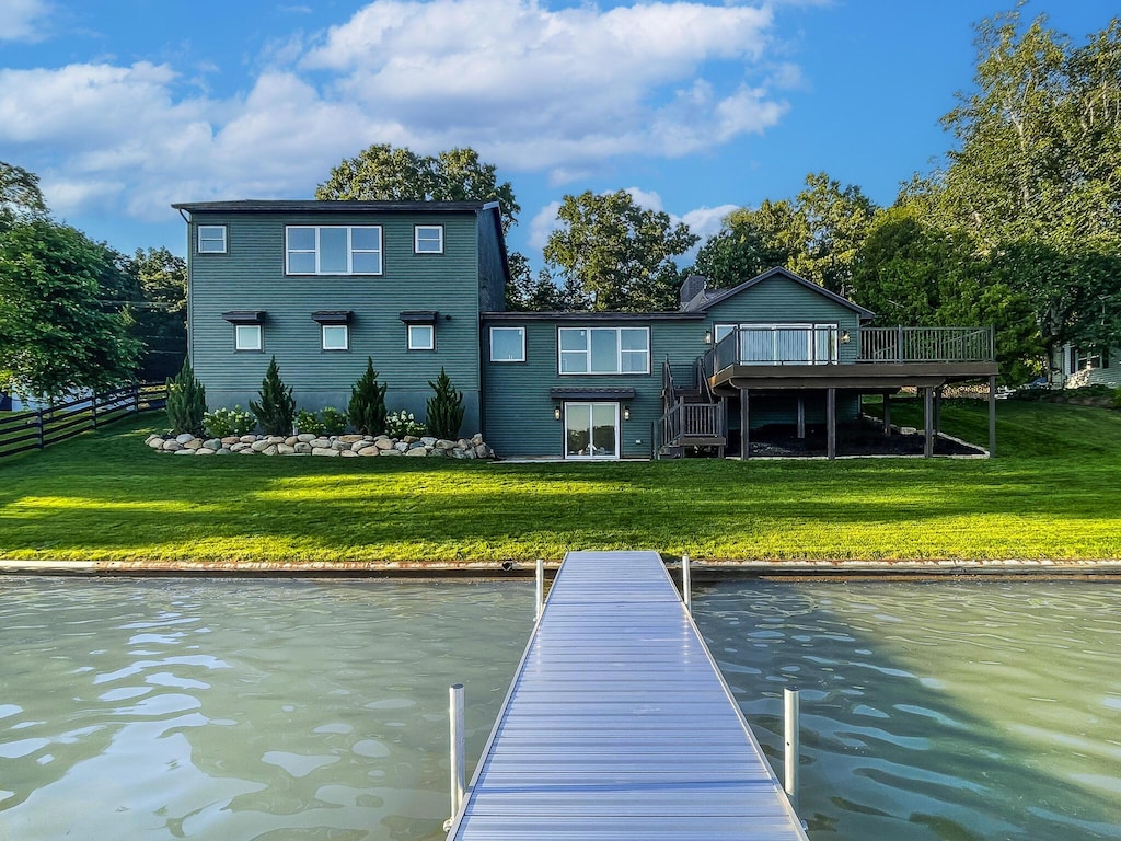 12475 Oakwood Shores St, Wayland, MI 49348 - rear view of property with a deck with water view and stairs