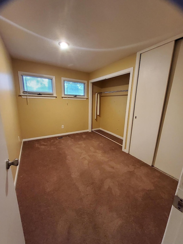 2828 Packard St, Ann Arbor, MI 48108 - unfurnished bedroom featuring carpet floors and baseboards