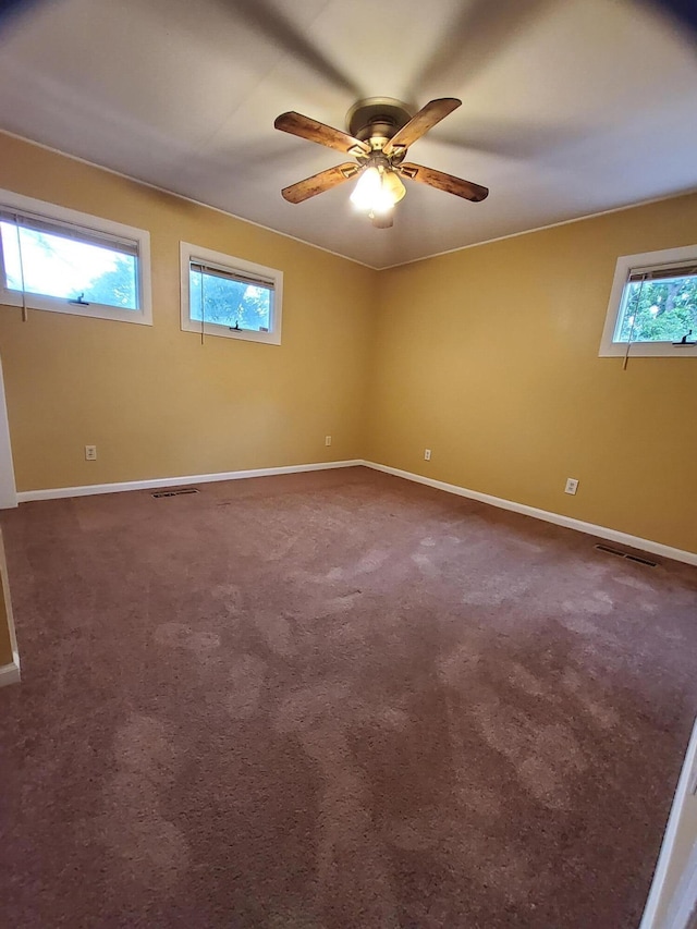 2828 Packard St, Ann Arbor, MI 48108 - empty room featuring ceiling fan and dark carpet