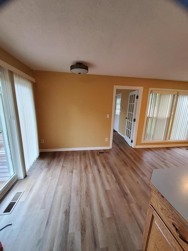 2828 Packard St, Ann Arbor, MI 48108 - empty room featuring wood finished floors and baseboards