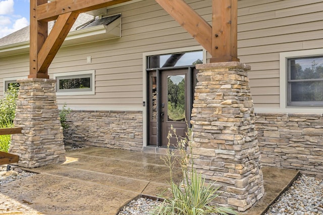 12500 Round Lake Rd, Horton, MI 49246 - view of exterior entry featuring stone siding