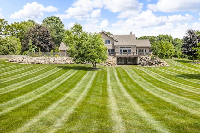 12500 Round Lake Rd, Horton, MI 49246 - back of house featuring a deck and stone siding