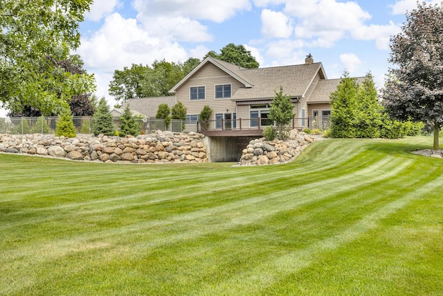 12500 Round Lake Rd, Horton, MI 49246 - back of house with a chimney and roof with shingles