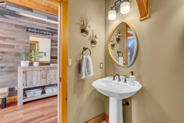 12500 Round Lake Rd, Horton, MI 49246 - bathroom with wooden walls and wood finished floors