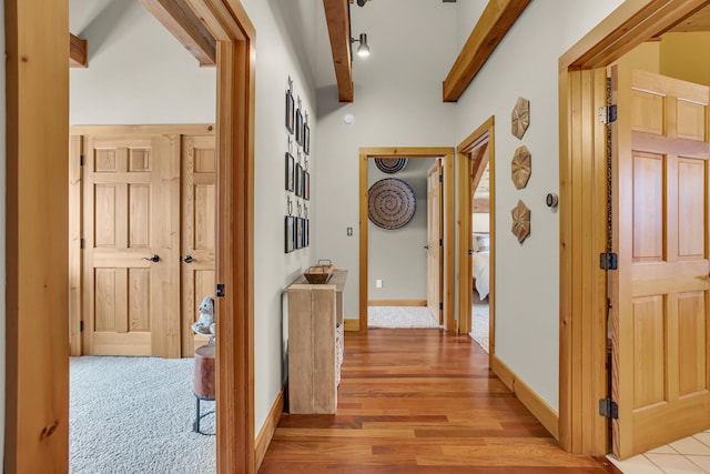 12500 Round Lake Rd, Horton, MI 49246 - corridor featuring beamed ceiling and light wood-style floors