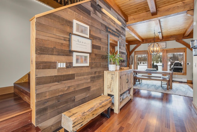 12500 Round Lake Rd, Horton, MI 49246 - dining space featuring wood walls, a wooden ceiling with exposed beams, a chandelier, and dark wood-style flooring