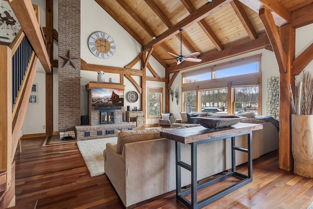 12500 Round Lake Rd, Horton, MI 49246 - living room with high vaulted ceiling, hardwood / wood-style flooring, a brick fireplace, a wooden ceiling with exposed beams, and ceiling fan