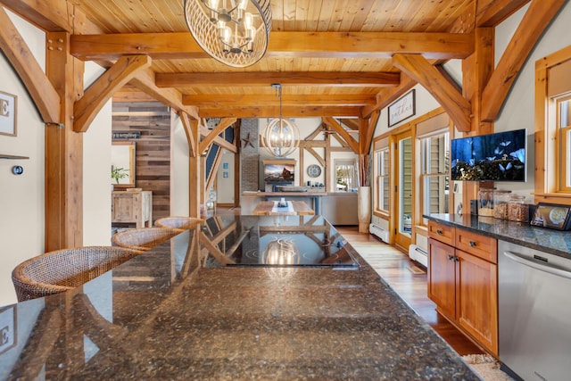 12500 Round Lake Rd, Horton, MI 49246 - dining room featuring a chandelier, wood finished floors, a wooden ceiling with exposed beams, wood walls, and a baseboard radiator