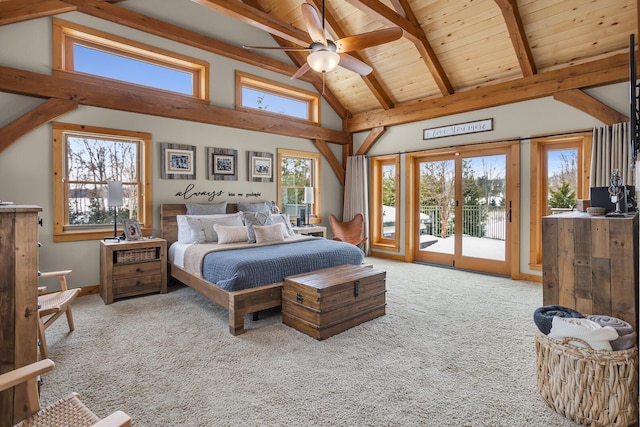12500 Round Lake Rd, Horton, MI 49246 - carpeted bedroom featuring access to exterior, multiple windows, a wooden ceiling with exposed beams, and high vaulted ceiling