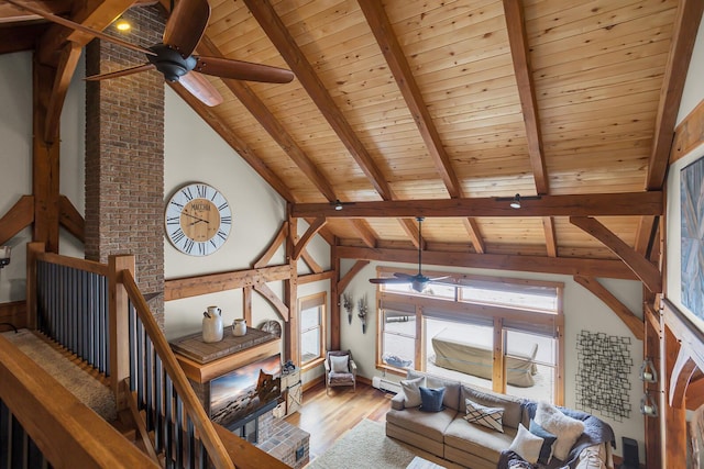 12500 Round Lake Rd, Horton, MI 49246 - living room featuring ceiling fan, wooden ceiling, wood finished floors, and plenty of natural light