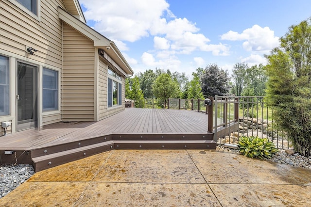 12500 Round Lake Rd, Horton, MI 49246 - deck with a patio area