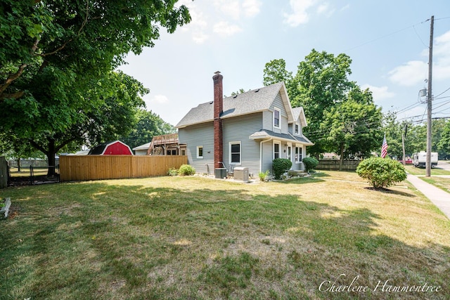 126 E Cherry St, Wayland, MI 49348 - rear view of house featuring a chimney and roof with shingles