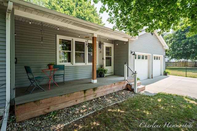 126 E Cherry St, Wayland, MI 49348 - wooden deck with a garage and driveway