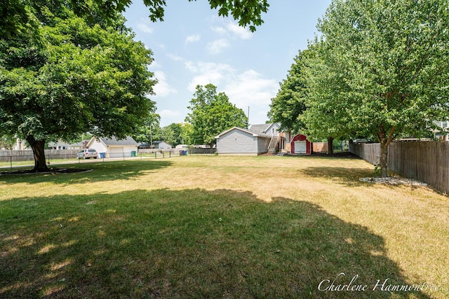 126 E Cherry St, Wayland, MI 49348 - fenced backyard featuring a storage unit