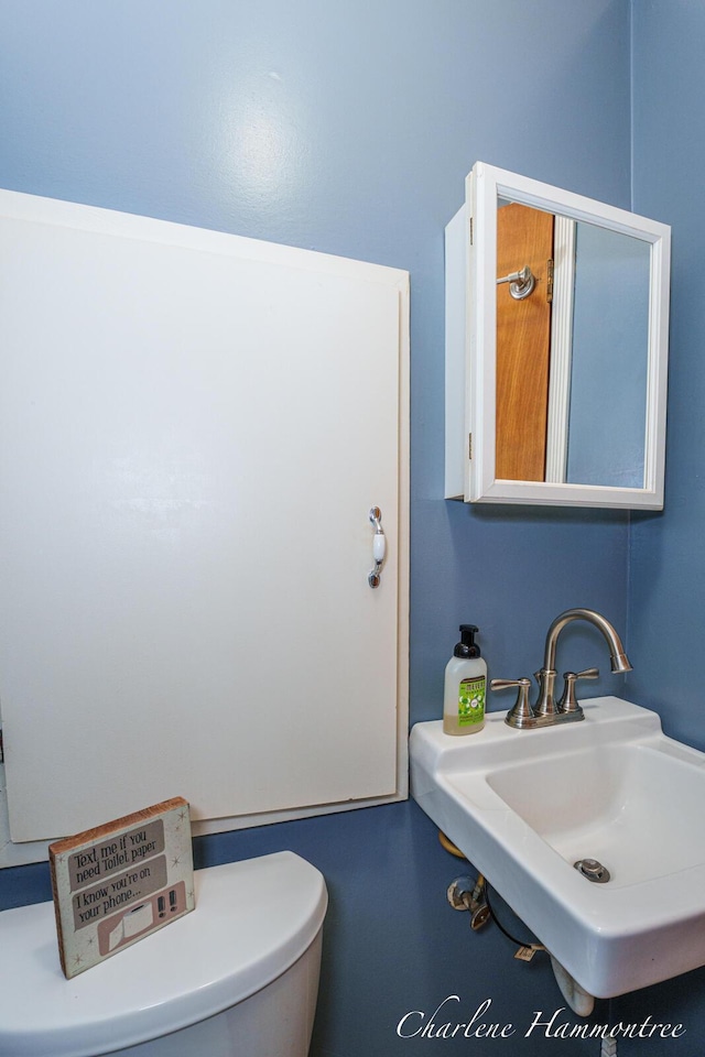 126 E Cherry St, Wayland, MI 49348 - half bath featuring a sink and toilet