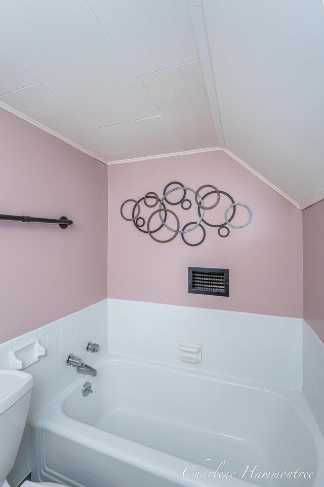 126 E Cherry St, Wayland, MI 49348 - bathroom with a garden tub, ornamental molding, and lofted ceiling
