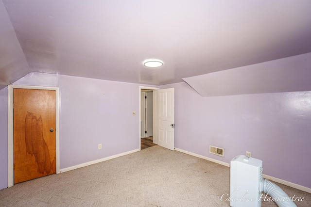 126 E Cherry St, Wayland, MI 49348 - additional living space with carpet flooring and vaulted ceiling