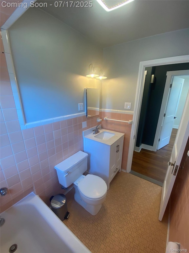 1417 N Maple Ave, Royal Oak, MI 48067 - full bathroom with tile walls, a bath, vanity, tile patterned floors, and wainscoting