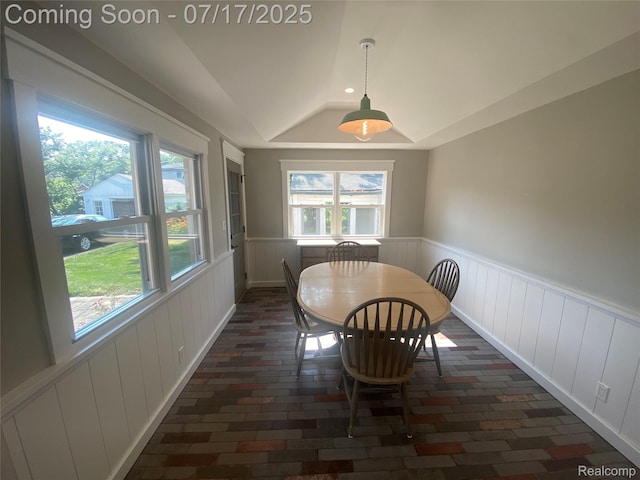 1417 N Maple Ave, Royal Oak, MI 48067 - dining area featuring wainscoting, brick floors, healthy amount of natural light, lofted ceiling, and a raised ceiling