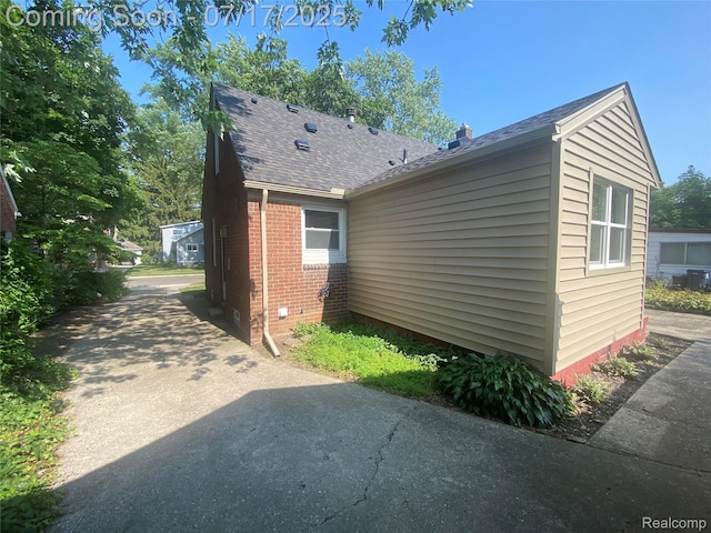 1417 N Maple Ave, Royal Oak, MI 48067 - view of property exterior with brick siding, driveway, and a shingled roof