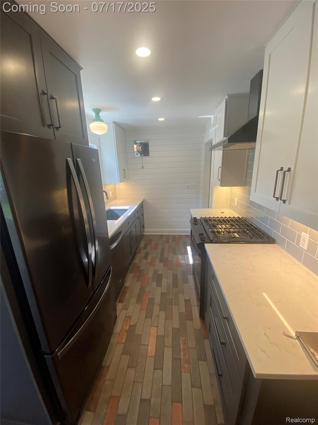 1417 N Maple Ave, Royal Oak, MI 48067 - kitchen featuring freestanding refrigerator, range with gas stovetop, brick flooring, tasteful backsplash, and recessed lighting