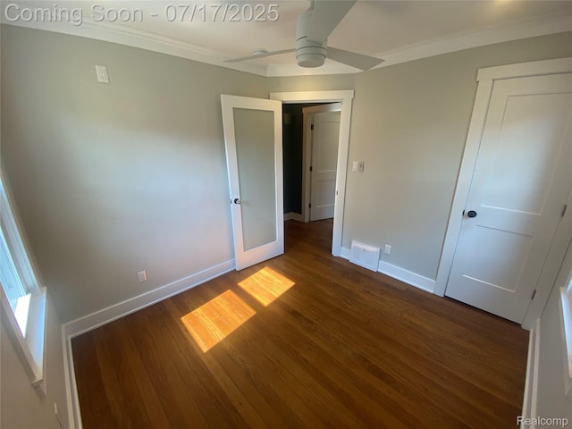 1417 N Maple Ave, Royal Oak, MI 48067 - unfurnished bedroom featuring dark wood-style flooring, ornamental molding, and a ceiling fan