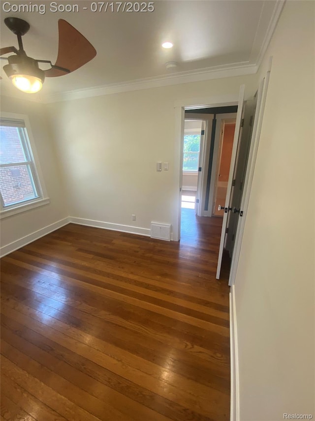 1417 N Maple Ave, Royal Oak, MI 48067 - spare room featuring plenty of natural light, dark wood-style flooring, a ceiling fan, and crown molding
