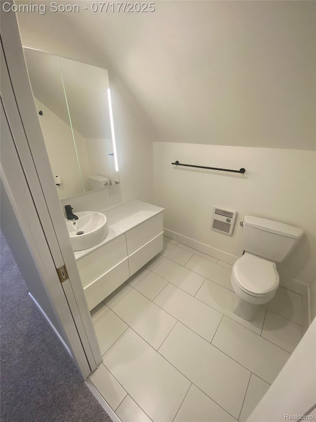 1417 N Maple Ave, Royal Oak, MI 48067 - bathroom with lofted ceiling, vanity, and tile patterned flooring