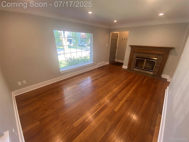 1417 N Maple Ave, Royal Oak, MI 48067 - unfurnished living room with dark wood-style floors, a fireplace, and recessed lighting