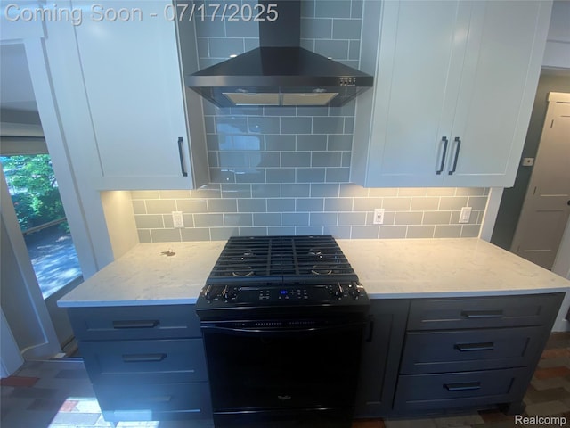 1417 N Maple Ave, Royal Oak, MI 48067 - kitchen featuring wall chimney range hood, black gas range oven, tasteful backsplash, light stone counters, and white cabinets
