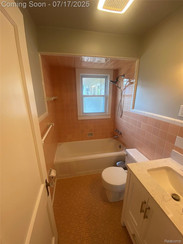 1417 N Maple Ave, Royal Oak, MI 48067 - bathroom with washtub / shower combination, vanity, and tile walls