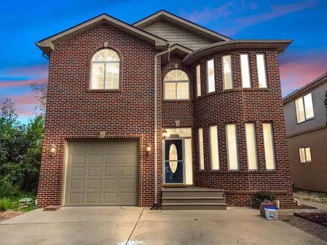 3165 Kenrick St, Keego Harbor, MI 48320 - view of front of house with brick siding, driveway, and an attached garage