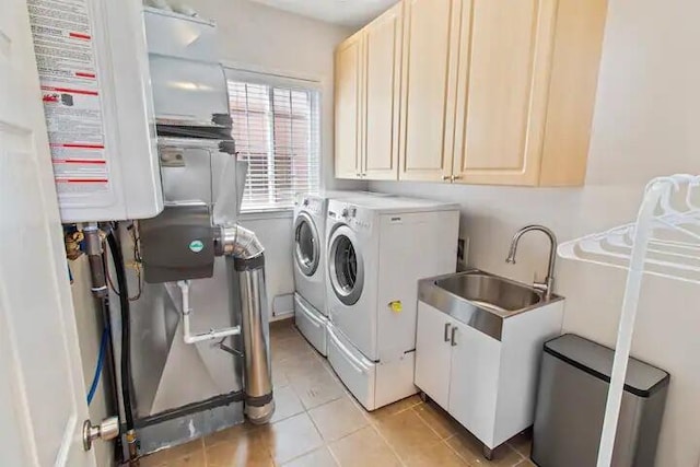 3165 Kenrick St, Keego Harbor, MI 48320 - laundry room with cabinet space, washer and dryer, water heater, and light tile patterned flooring