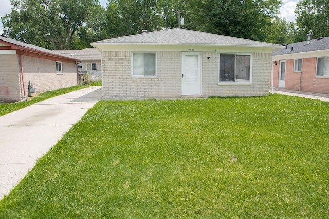 9641 Wilkie St, Taylor, MI 48180 - view of front of home with brick siding and a front lawn