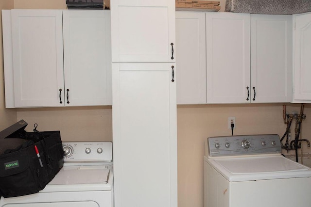 9641 Wilkie St, Taylor, MI 48180 - laundry room featuring cabinet space and independent washer and dryer