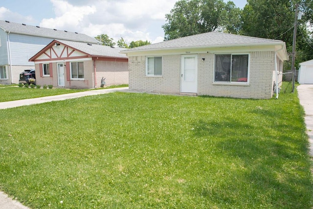 9641 Wilkie St, Taylor, MI 48180 - view of front facade with brick siding and a front lawn