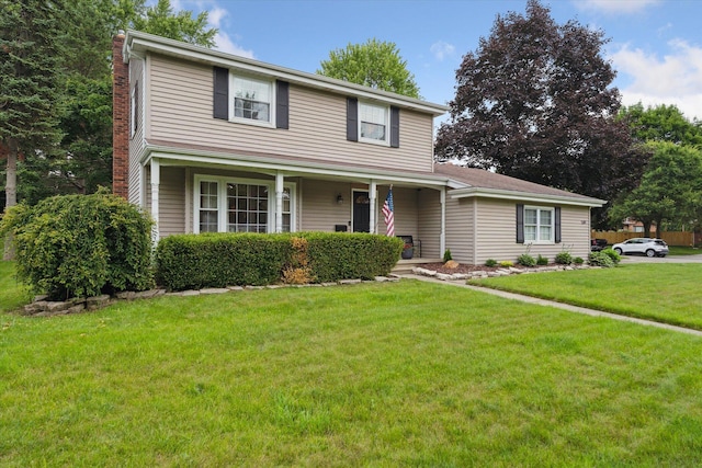 539 Old Bridge Rd, Grand Blanc, MI 48439 - traditional home with a chimney, a front lawn, and covered porch