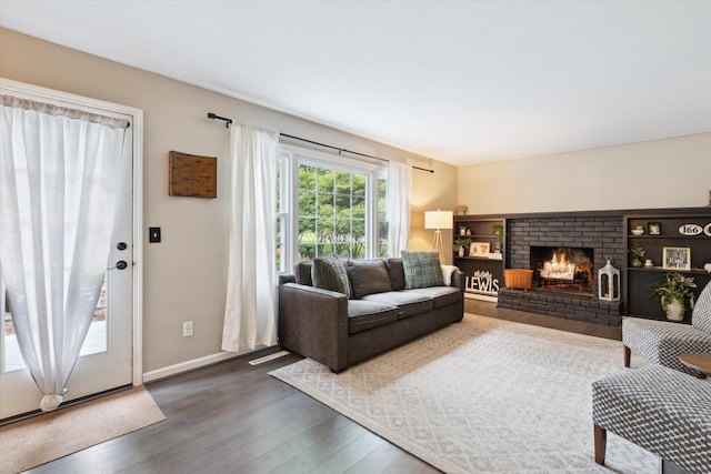 539 Old Bridge Rd, Grand Blanc, MI 48439 - living area with wood finished floors and a brick fireplace