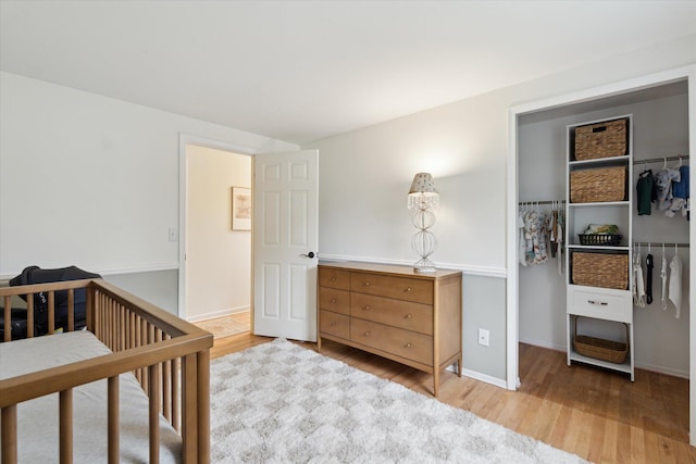 539 Old Bridge Rd, Grand Blanc, MI 48439 - bedroom featuring light wood-style floors and baseboards
